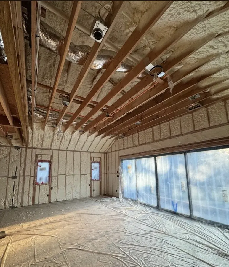 Interior walls and ceiling insulated with spray foam during new construction in North Berwick